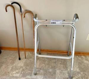 lot 143 image: Adjustable Height Mobility Walker and 3 Canes