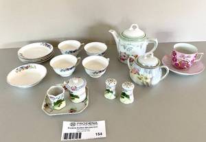 lot 154 image: Various Tea Cups, Saucers and Salt & Pepper Shakers 