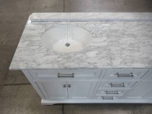 lot 38 image: Home Decorators Collection Windlowe 61 in. W x 22 in. D x 35 in. H Bath Vanity in White with Carrera Marble Vanity Top in White with White Basin 15101-VS61C-WT