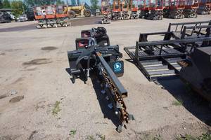 lot 13 image: Brand New Grey Wolf Brand Universal Mount Bobcat Skid Loader Skid Steer Hydraulic Trencher Attachment