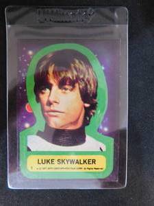 lot 106 image: 1977 Topps Sticker Luke Skywalker Rookie Card #1