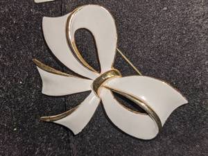 Two Art Deco White Enamel Brooches