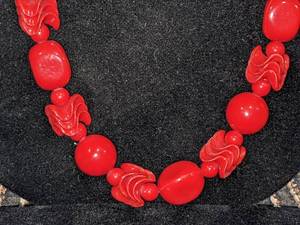 Red Beaded Necklace with Various Sizes and Shapes