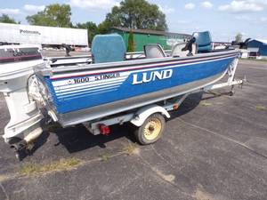lot 1 image: Lund 1600 Stinger Boat with Trailer and 50 HP Johnson Outboard Motor