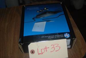 lot 33 image: 65 watt slim AC adapter...