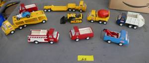 lot 65 image: TONKA Toys - all of these are Tonka and in good shape.  Not rusted up. Garbage truck, wrecker, fire truck, car hauler, cement truck.  Looks like hours of fun.