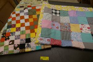 lot 77 image: 3 vintage lap quilts, some light damage on them