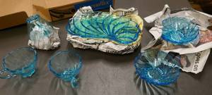 lot 87 image: Vintage dishes, beautiful 50s blue swirl set for 4, 4 cups, bowls and fancy plates all in perfect condition, then a clear glass set also for 4 but is missing some pieces, 4 plates 3 cups, 5 bowls with handles and 1 creamer
