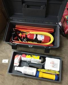 lot 93 image: Road Safety Kit - Fire extinguisher, reflective triangles, jumper cables, Fix-a-flat, washer fluid, vest, flashlight, bandaids, scraper