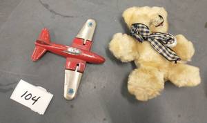 lot 104 image: Old hubley airplane with flip up wings (missing wheels) and antique teddy bear