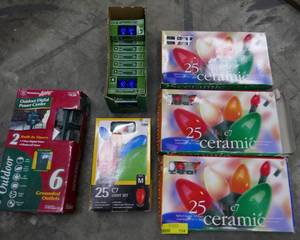 lot 114 image: 4 new boxes of indooroutdoor christmas lights, case of replacement bulbs and a 6 plug outdoor outlet