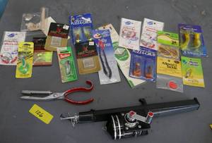 lot 126 image: Vintage fish scaler and Cosom Fishing Machine extending rod - looks like new, along with some baits and tackle