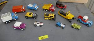 lot 132 image: TONKA Toys - all of these are Tonka and in good shape, the only one that is plastic is the snowmobile.  Some nice vintage ones in here.