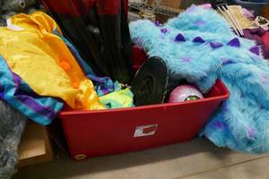 lot 166 image: Large tote filled with adult halloween costumes