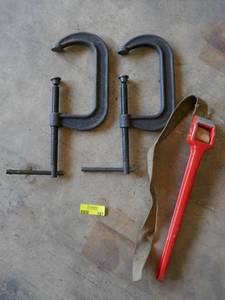 lot 197 image: 2 large C clamps and a Ridgid strap wrench