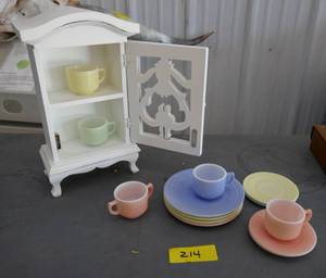 lot 214 image: Cute little cupboard with kids play cups and saucers and plates