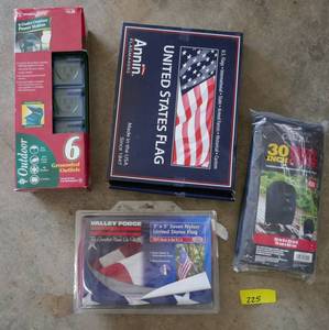 lot 225 image: 2 flags, outdoor outlets and a grill cover