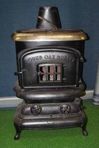 lot 2 image: Vintage Beckwith Company Round Oak Duplex Wood Stove