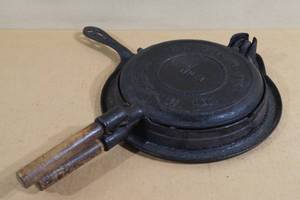 lot 74 image: Antique Cast Iron Waffle Maker Set