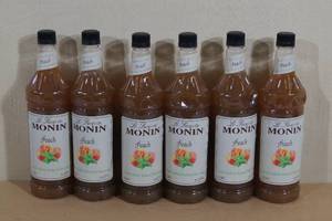 lot 112 image: Sirop de Monin Peach Flavoring