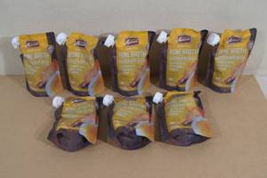 lot 23 image: Merrick Grain Free Bone Broth Dog Food Topper