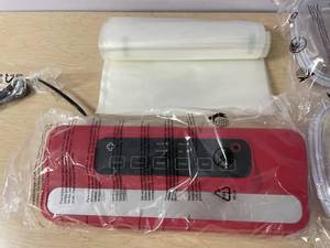 lot 952 image: New Red Storable Solutions Vacuum Packaging System Model 112