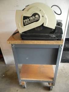 lot 7 image: PRO TECH CONTRACTOR SERIES CS7014 CHOP SAW ON ROLLONG CABINETSTORAGE STAND - PLUS A BUNCH OF BLADES - WORKS - NICE SHOP SETUP - SEE PICTURES