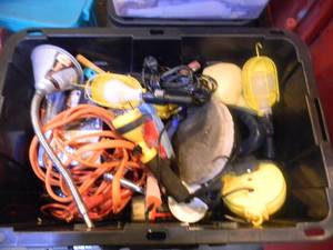 lot 27 image: LARGE - TOTE FULL OF AUTOMOTIVE STUFF - HANGING LIGHTS, FLOOR CREEPER, POLISHER, BATTERY CABLES & CHARGER & MORE - SEE PICTURES