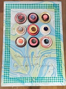 lot 133 image: (9) 20th Century Stacked Dyed Shell Buttons