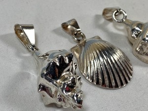lot 453 image: Three Sterling Seashell Pendants