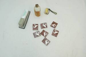 lot 109 image: Advertisement items and vintage bottle