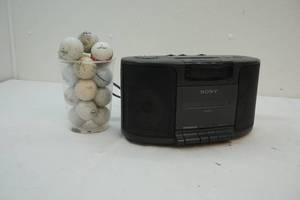 lot 222 image: Golf balls and radio