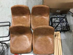 lot 19 image: Lot of 2 26 in. Sand Faux Leather Counter Stool with Black Base (Set of 2) by OSP Home Furnishings Customer Returns See Pictures