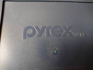 lot 280 image: Covered Pyrex and Steamer Dish.