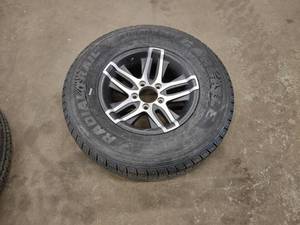 lot 287 image: Rim with Tire, 21575R14, New...