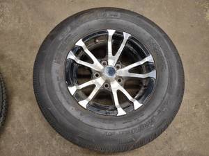 lot 292 image: Aluminum Rim with Tire, 21575R14, ...
