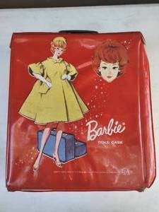 lot 6 image: Red Barbie Doll Case with One Mattel Barbie Doll