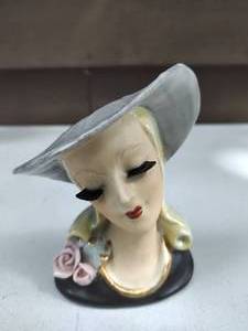 lot 33 image: Two Vintage Lady Head Vases