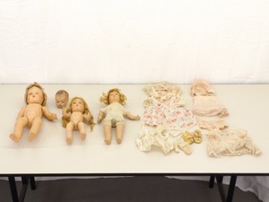 lot 63 image: Lot of Antique Dolls, Head, with Blinking Eyes etc., Clothes