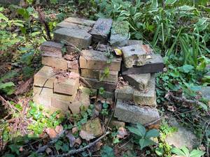 lot 299 image: Large Lot of Many Piles of Bricks