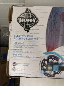 lot 38 image: Huffy Frozen II Electrolight Folding Scooter