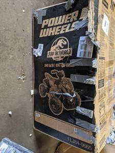 lot 479 image: Power Wheels Jurassic World Dino Racer 12V Ride-On