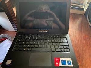 lot 15 image: Thomson 10 laptop computer wcharg...