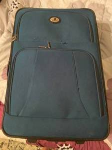 lot 52 image: Large suitcase with wheels