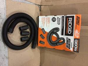 lot 42 image: RIDGID 2-12 in. x 7 ft. Dual-Flex Tug-A-Long Locking Vacuum Hose for RIDGID WetDry Shop Vacuums Customer Returns See Pictures