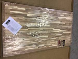 lot 77 image: HARDWOOD REFLECTIONS Unfinished Acacia 6 ft. L x 39 in. D x 1.5 in. T Butcher Block Island Countertop Customer Returns See Pictures