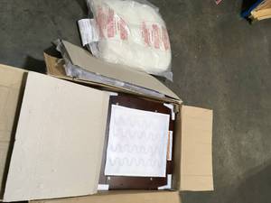 lot 36 image: Storkcraft Hoop Glider and Ottoman open box see pictures