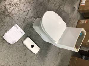 lot 215 image: Sublime II 1-Piece 0.81.28 GPF Dual Flush Elongated Toilet in White by Swiss Madison