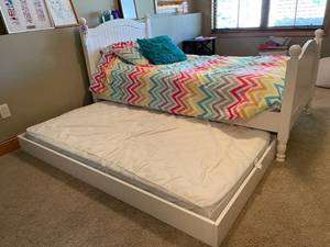 lot 64 image: Pottery Barn Twin Sized Trundle Bed with Wooden Head and Footboard