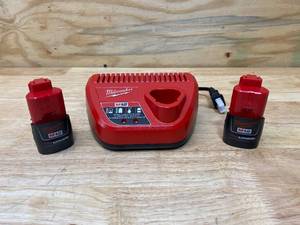 lot 29 image: MILWAUKEE M12 12-Volt Lithium-Ion Battery Charger with 2- M12 12-Volt Lithium-Ion Compact Battery Packs (1.5Ah)